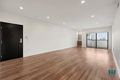 Front Entrance, Living Room with Built-In Cabinet, Shelving, Vinyl Flooring, Recessed Lighting, and Patio