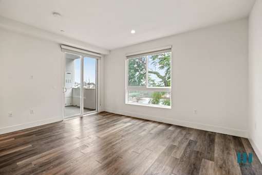 Bedroom with Patio, Vinyl Flooring, and Large-Size Windows