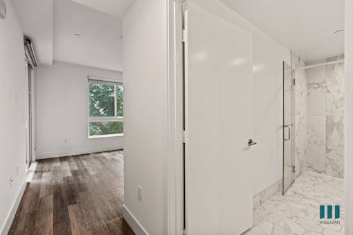 Bedroom with Bathroom, Patio, and Vinyl Flooring
