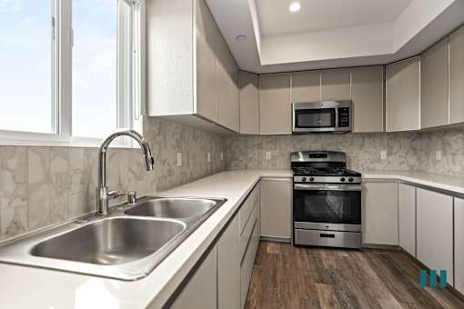 Kitchen with Energy-Efficient Appliances and Ample Cabinet Storage
