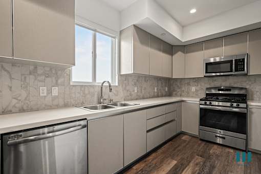 Kitchen with Energy-Efficient Appliances, Vinyl Flooring, and Recessed Lighting