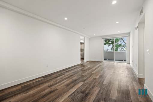 Open-Concept Living and Dining Room with Patio
