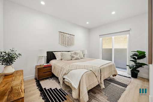 Spacious Bedroom with Private Patio, Recessed Lighting, and Vinyl Flooring