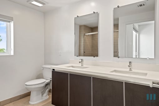 Bathroom with Double-Sink Vanity and Cabinet Storage