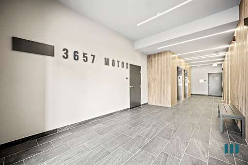 A hallway with a sign that says "3657 MOTOR" on the wall.