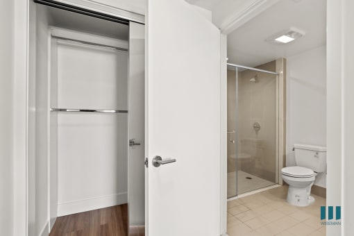 Bedroom with Hanging Closet and Bathroom with Stand-In Shower