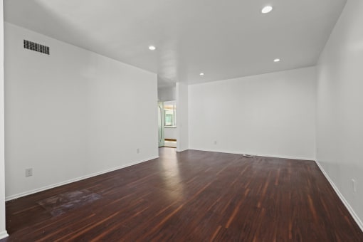 Spacious Living Room with Recessed Lighting and Vinyl Flooring