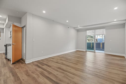 Living Room with Recessed Lighting, Vinyl Flooring, and Patio with Roll-Down Shades