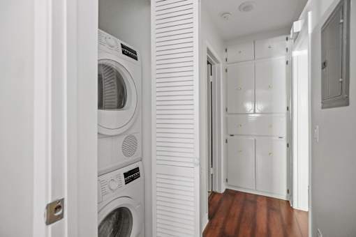 a laundry room with a washer and dryer and a closet