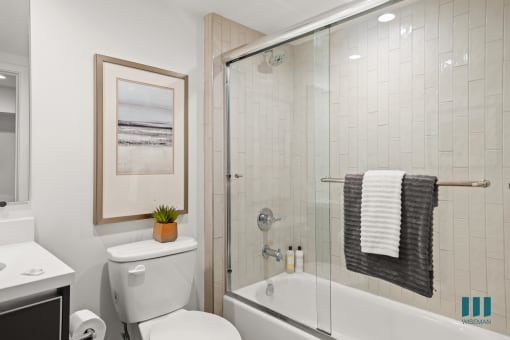 Full-Size Bathroom with Bathtub with Glass Door