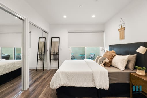 Bedroom with Mirrored Closet, Vinyl Flooring, and Recessed Lighting