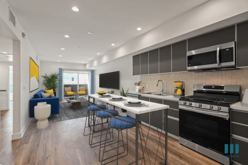 Open-Concept Kitchen, Dining, And Living Room with Patio