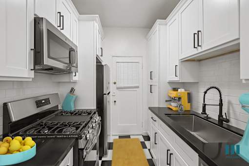 Kitchen with Stainless-Steel Refrigerator, Stove, Microwave Oven, and Dishwasher