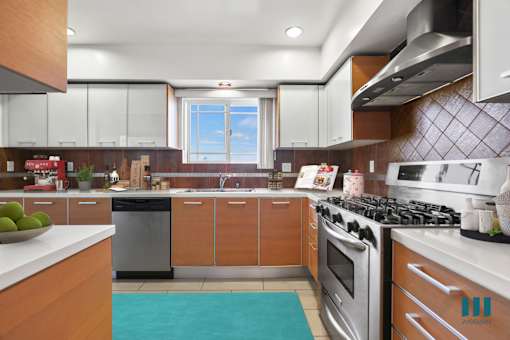 Full-Size Chefs Kitchen with Stainless-Steel Appliances and Ample Cabinet Storage