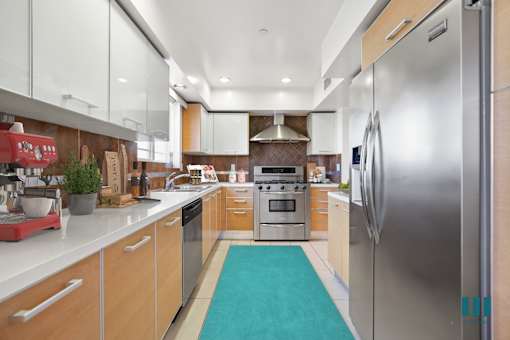 Full-Size Kitchen with Wnergy-Efficient Refrigerator, Stove, Microwave Oven, and Dishwasher