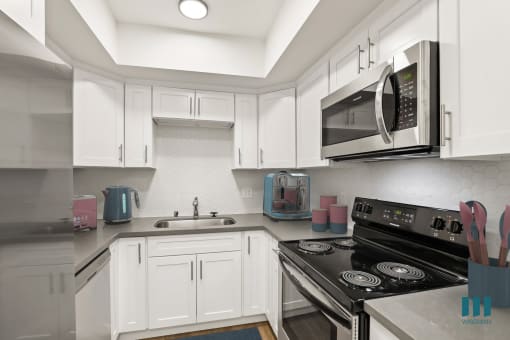 Kitchen with Stainless Steel Refrigerator, Stove, Microwave Oven, and Dishwasher