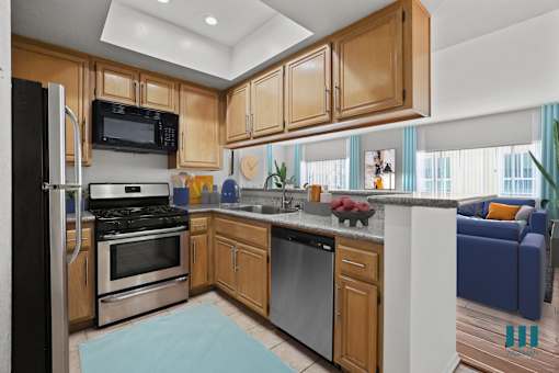 A kitchen with wooden cabinets and a black refrigerator.