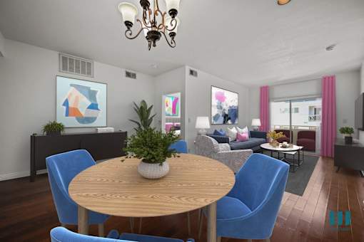 A living room with a wooden table and blue chairs.