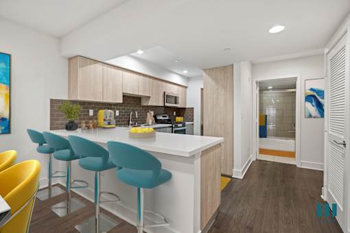 Kitchen with Countertop Bar and Stainless-Steel Appliances