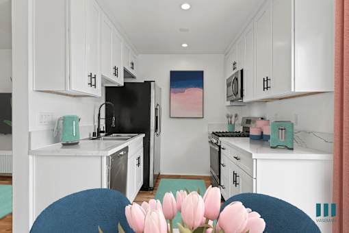 Kitchen with Stainless-Steel Refrigerator, Stove, Dishwasher, and Microwave Oven