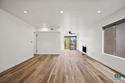 Open-Concept Living Room and Dining Room with a Fireplace