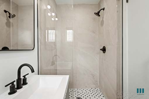 Bathroom with a Walk-In Shower and Vanity Cabinet Storage