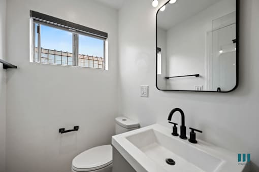 Bathroom with a Vanity Cabinet and a Window