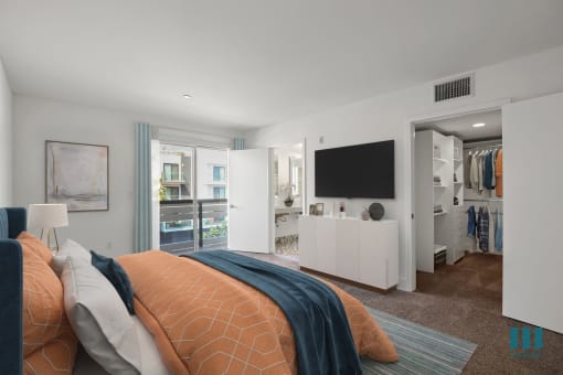Bedroom with Walk-In Closet with Built-In Organizers, Bathroom, and Balcony