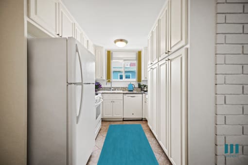 Kitchen with Refrigerator, Stove, Microwave Oven, Dishwasher, and Ample Cabinet Storage