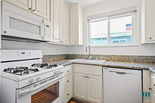 Kitchen with Refrigerator, Stove, Dishwasher, and Microwave Oven