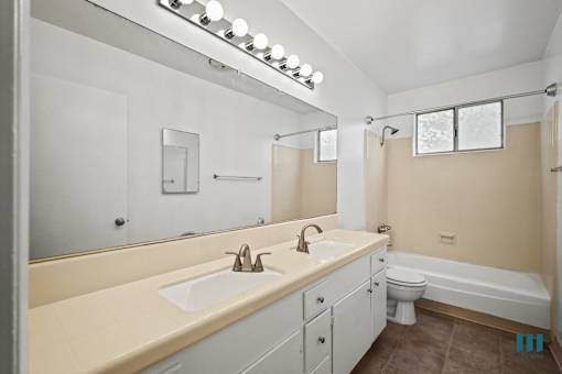 Bathroom with a Shower-Bath and Vanity Cabinet Storage