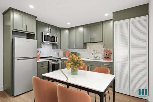 Studio with Full-Size Kitchen with Refrigerator, Stove, and Microwave Oven
