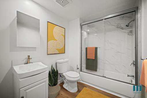 Bathroom with Shower Bath with Glass Door and Vanity Cabinet Storage