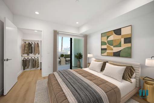 A bedroom with a large bed and a painting on the wall.
