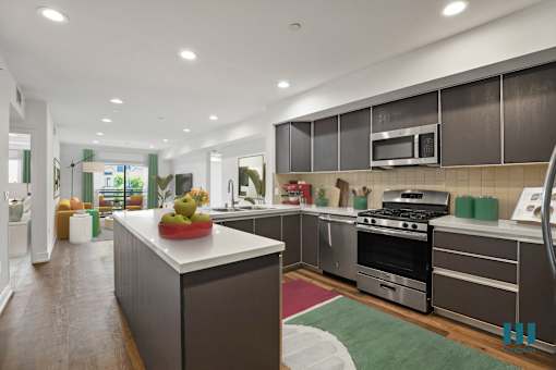 Open-Concept Kitchen, Dining, and Living Room with a Patio