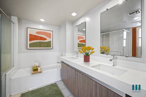 Primary Bathroom with a Walk-In Shower, Bathtub, and Double-Sink Vanity,