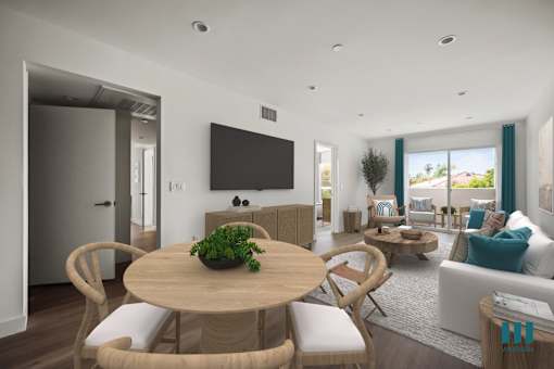 a living room and dining room with a table and chairs