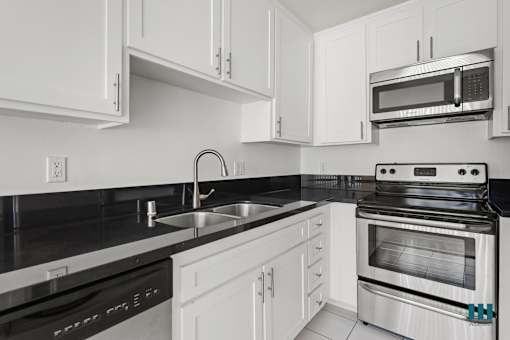 Kitchen with Dishwasher, Stove, Microwave Oven, and Refrigerator