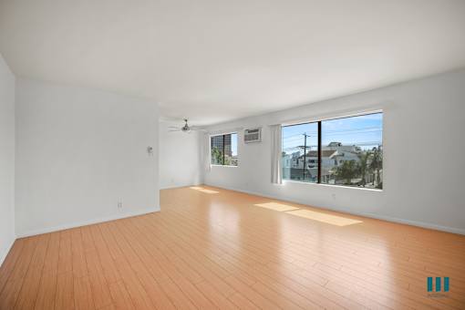 Large-Size Open-Concept Living and Dining Room with Natural Light and Vinyl Flooring