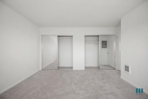 Bedroom with Two Mirrored Closets