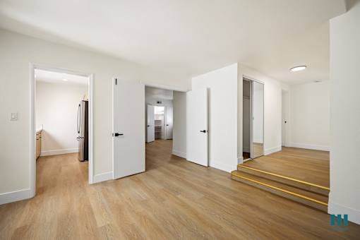 Living Room with Vinyl Flooring and a Hall Closet