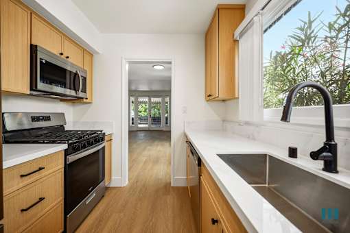 Kitchen with Energy-Efficient Appliances and Ample Cabinet Storage