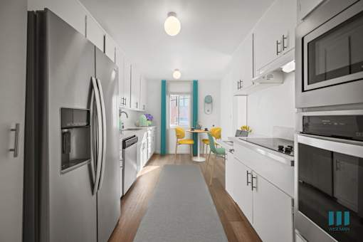 A modern kitchen with stainless steel appliances and white cabinets.