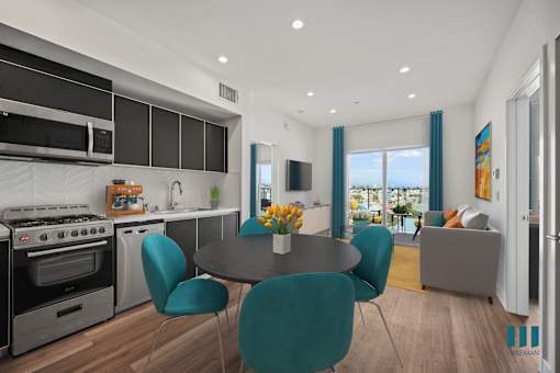 Open-Concept Kitchen, Dining, and Living Room with Patio - Dunn Floor Plan