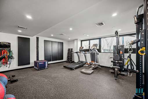 Fitness Center with Resisitance Bands, Free Weights, Treadmills, and Universal Exercise Equipment