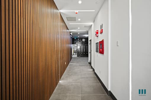 Hallway Leading to Mailbox Area at Ogden Garden by Wiseman, California, 90036