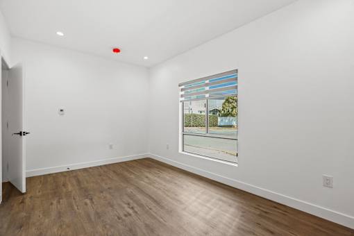 Bedroom with Large-Size Windows, Recessed Lighting, and Vinyl Floors