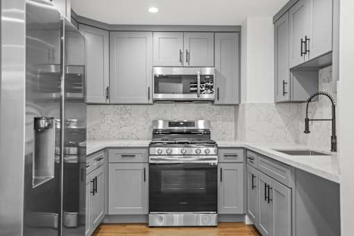 Kitchen with Energy-Efficient Appliances and Ample Cabinet Storage