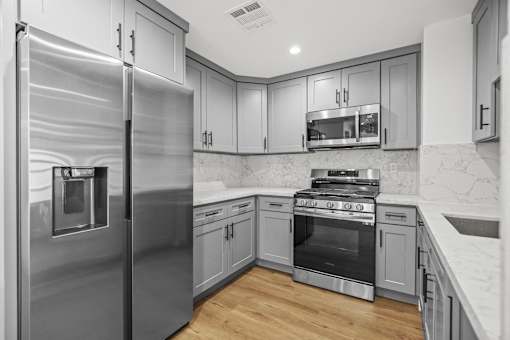 Kitchen with Stainless-Steel Refrigerator, Stove, Microwave Oven, and Dishwasher