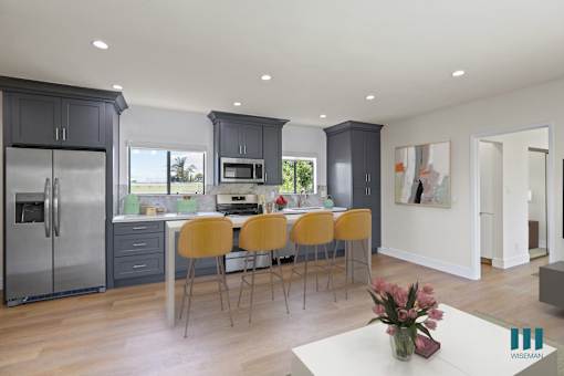 Open-Concept Kitchen Energy-Efficient Appliances and with Countertop Island Bar